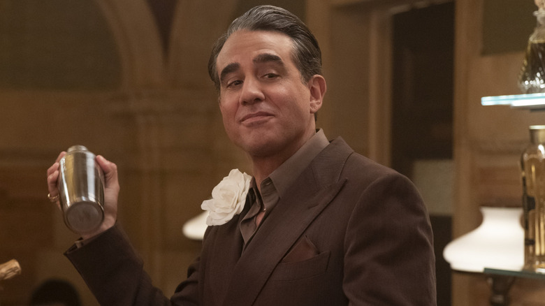 Nciky shaking a cocktail shaker in