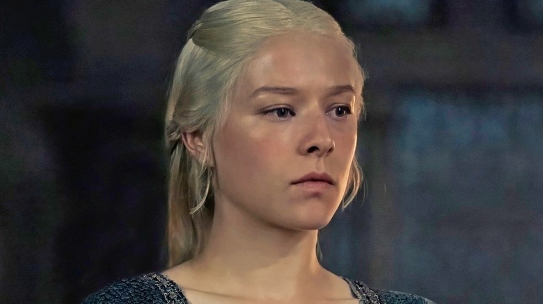 Rhaenyra in a blue cloak staring ahead on House of the Dragon