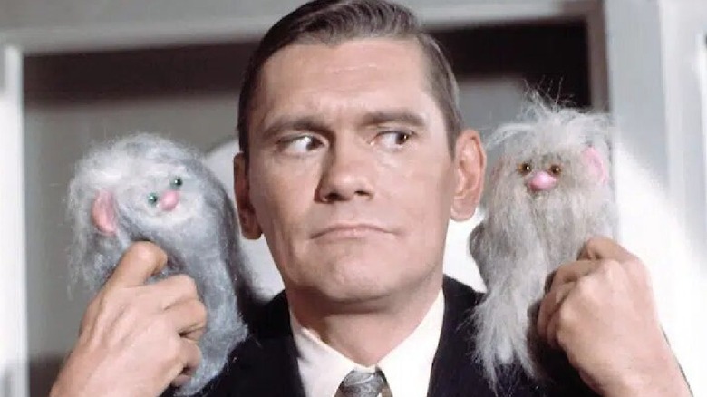 Darrin Stephens with two creatures on his shoulders