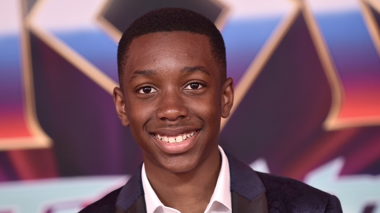 Kieron L. Dyer wearing a suit