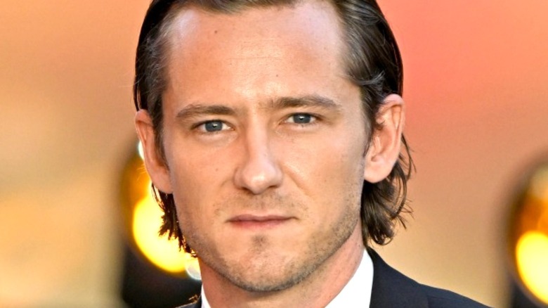 Lewis Pullman looking into camera