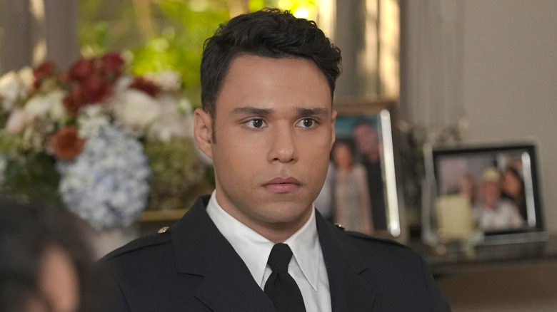 Carlos Reyes wearing formal uniform and badge