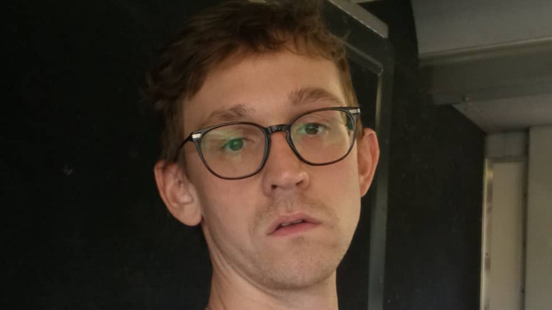 Caleb Ellsworth-Clark in glasses