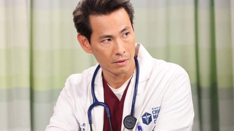 Dr. Lieu listening intently to someone talking