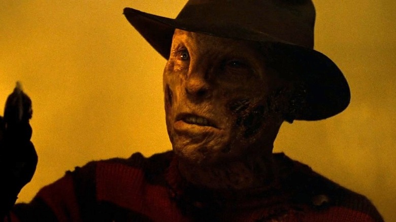 Freddy points clawed finger
