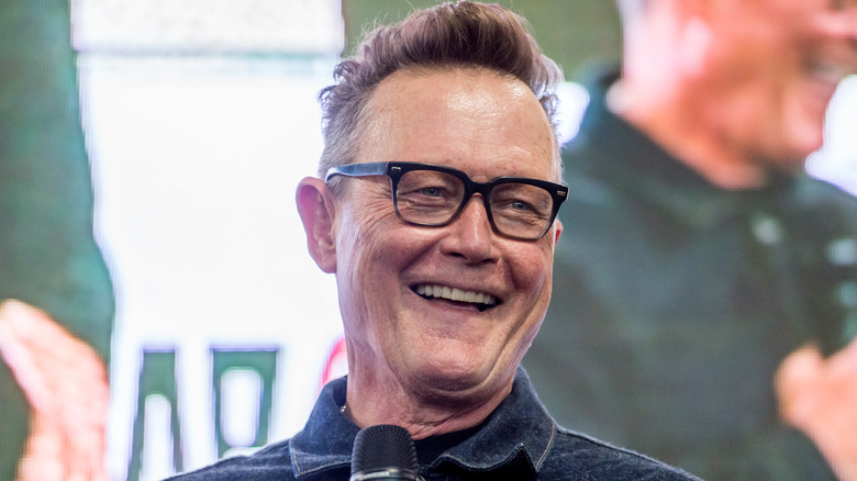 Robert Patrick laughing into microphone