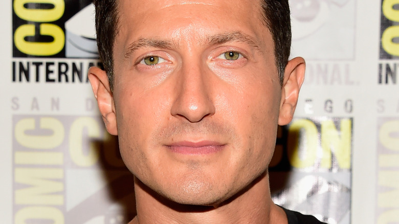 Sasha Roiz serious