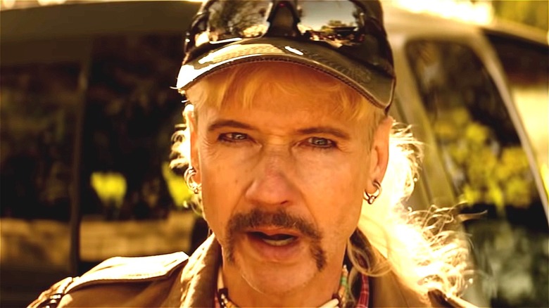 John Cameron Mitchell wearing hat as Joe Exotic