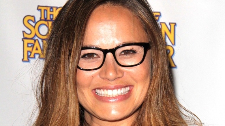 ECU of Moon Bloodgood wearing glasses