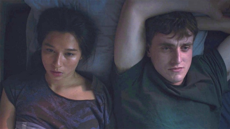 Connell and Helen laying in bed together
