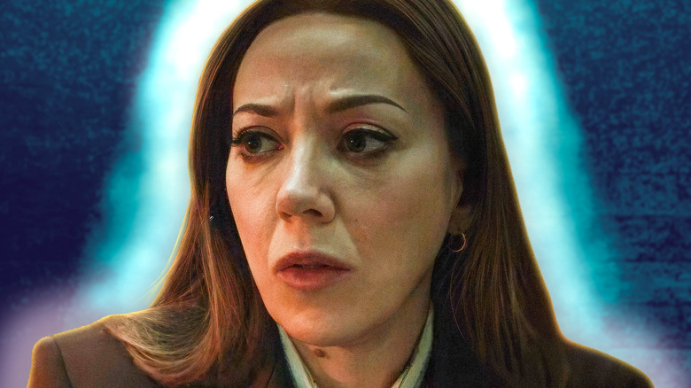 The Handler with a glowing blue light around her on 