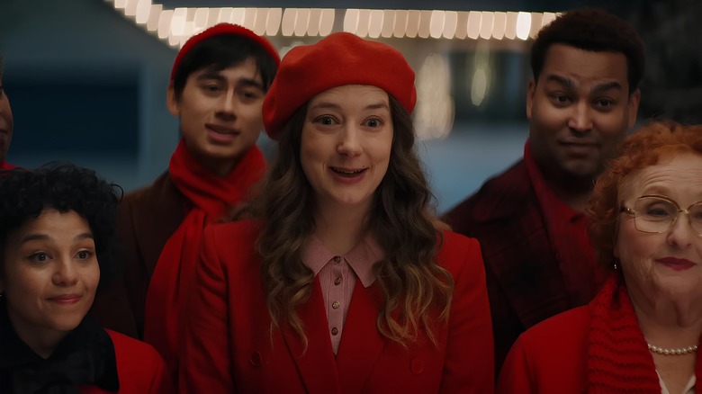 Woman in red hat singing