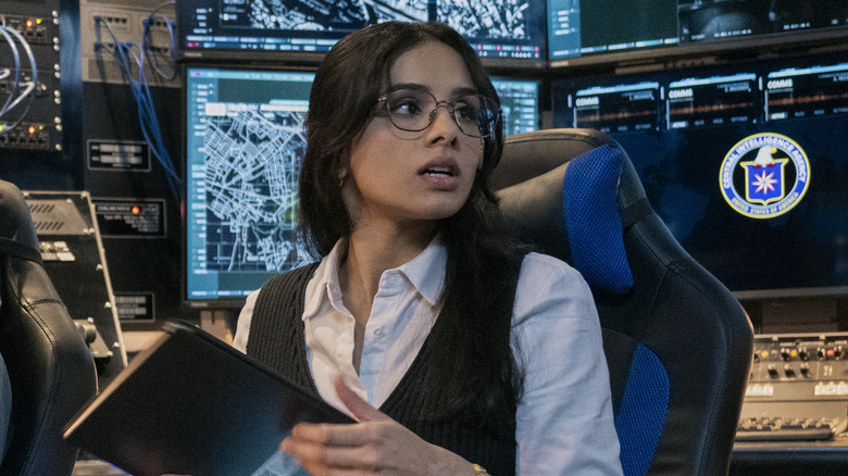 Barry and Tina sitting at surveillance screens