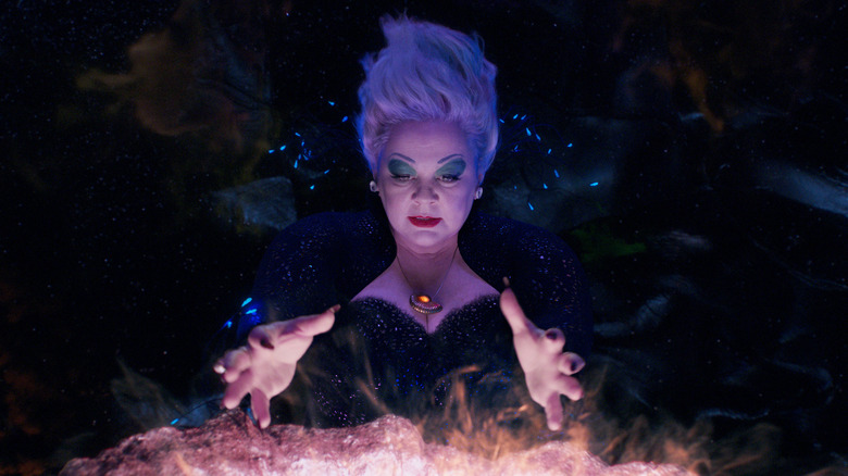Ursula holding her hands out as she magically casts a spell