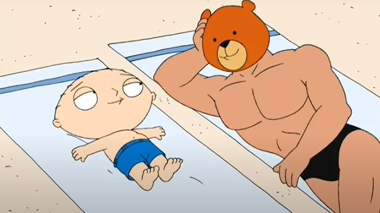Stewie and Rupert lying on the beach