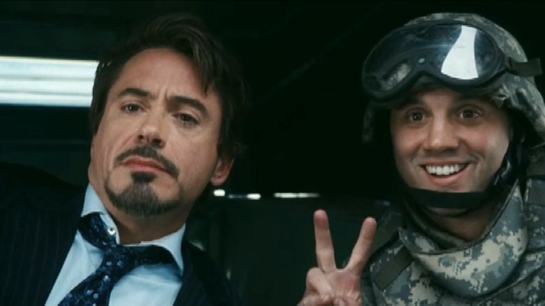 A solider posing with Tony Stark