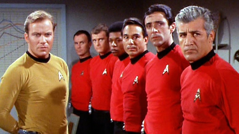 Kirk standing in front of redshirts