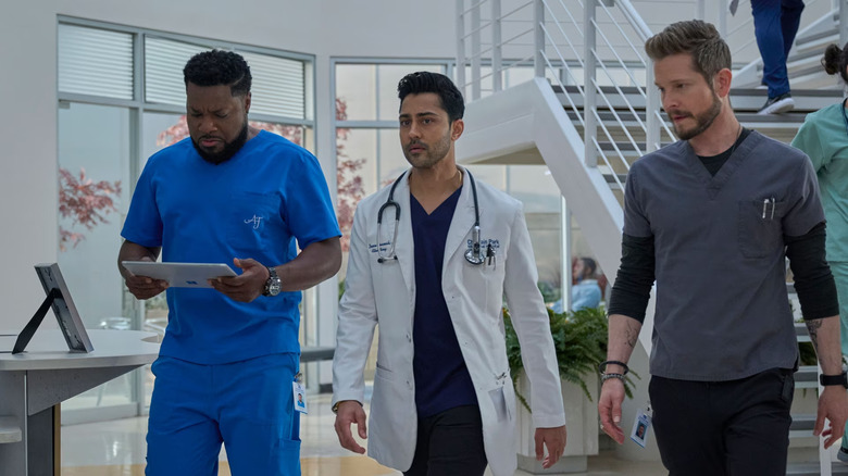 Cast of The Resident walking through hallway