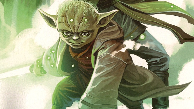 A younger Yoda holding his lightsaber