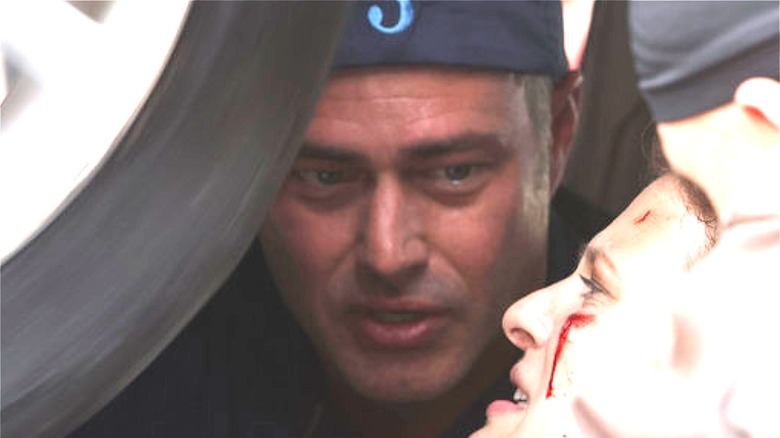 Taylor Kinney with bleeding victim