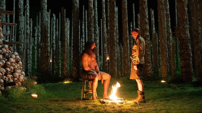 Samson and Dr. Ian Kelson against a campfire in 28 Years Later: The Bone Temple (2026)