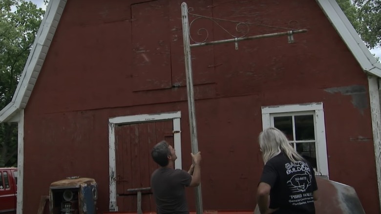 Mike Wolfe holding a pole