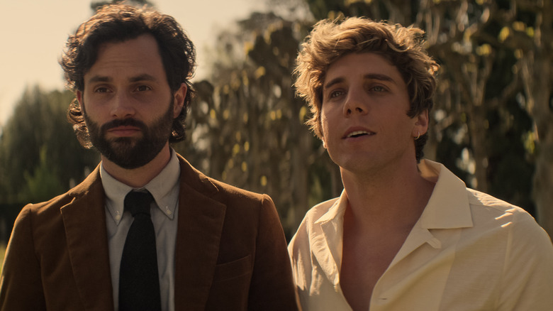 Penn Badgley and Lukas Gage standing outside