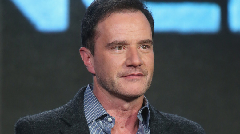 Tim DeKay sitting