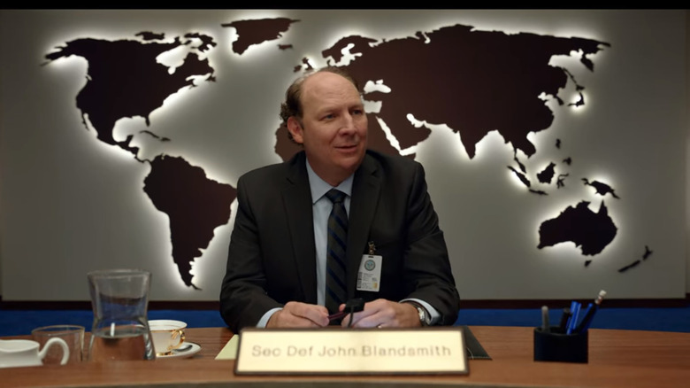 John Blandsmith sitting at desk
