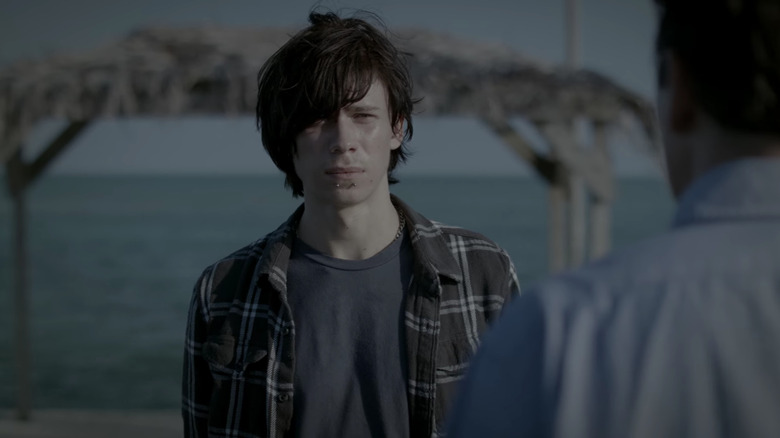 Nolan Rayburn standing in front of ocean