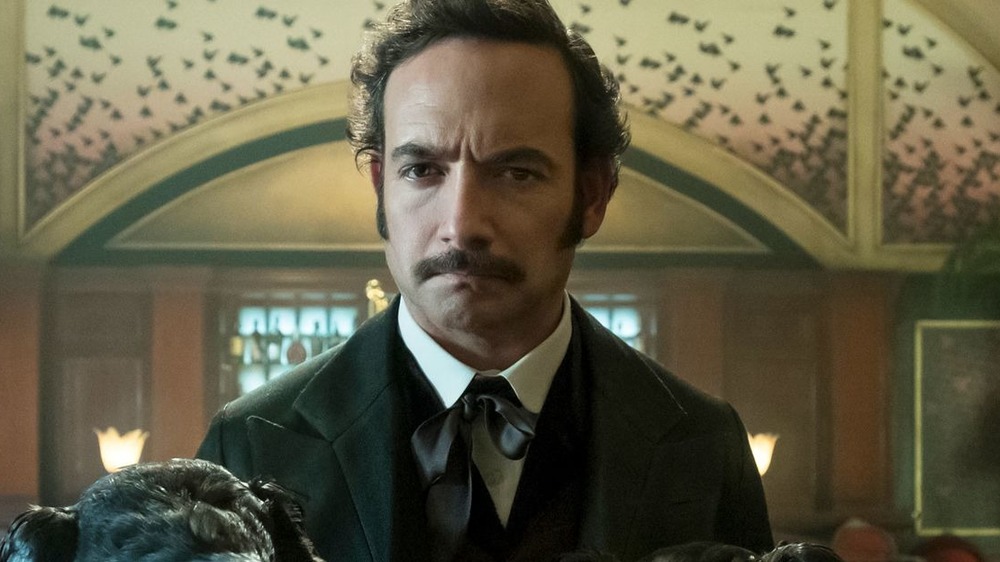 Poe grimacing