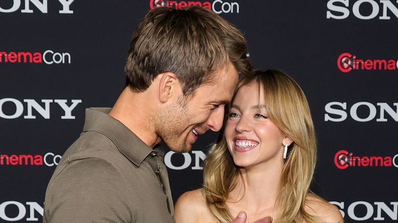 Glen Powell and Sydney Sweeney laughing