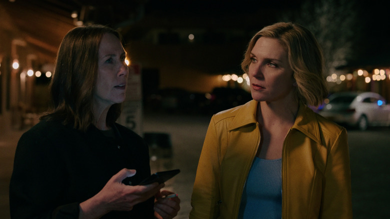 Helen and Carol talking in restaurant parking lot in Pluribus