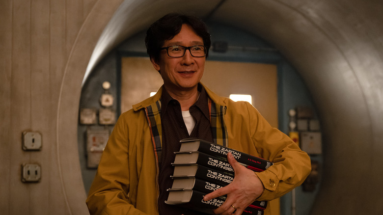 O.B. carrying books and looking friendly on Loki