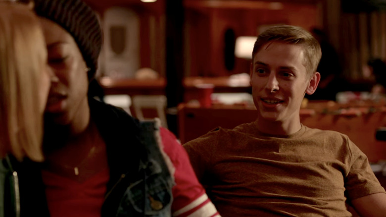 Roger sitting with Poussey and Franzi