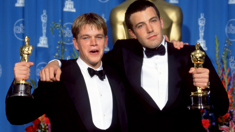 Ben Affleck Matt Damon holding Oscars