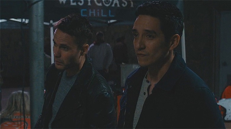 Paul and Miguel walking at night 