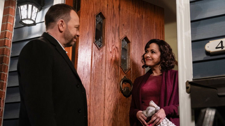 Maria Baez and Danny Reagan smile at each other in 