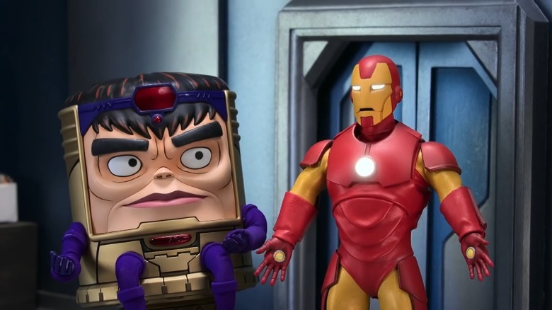 Iron Man talks while M.O.D.O.K. looks on