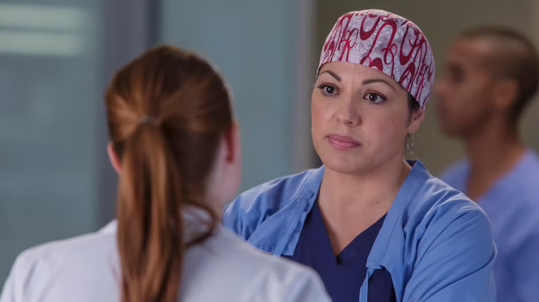 Callie Torres in a scrub cap frowning on Grey's Anatomy