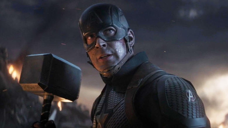 Captain America wielding Thor's hammer