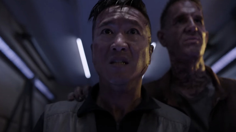 Doctor Prax being led away by guard