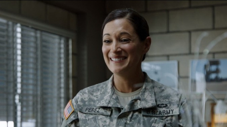 Angelique Cabral in a military uniform looking excited