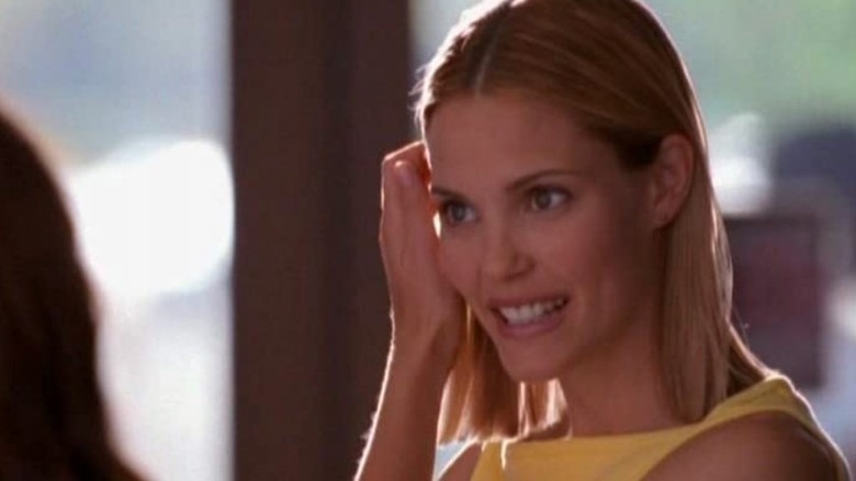 Brooke McQueen brushing her hair