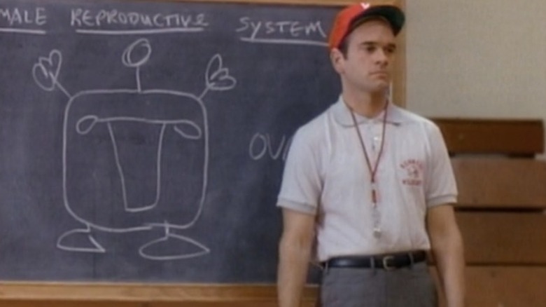 Robert Picardo standing next to a chalkboard