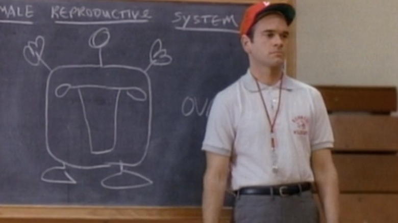 Robert Picardo standing next to a chalkboard