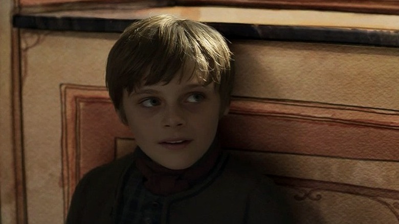 Billy Barratt as young Scrooge