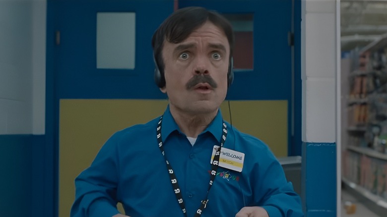 Mitch entering store with stunned expression