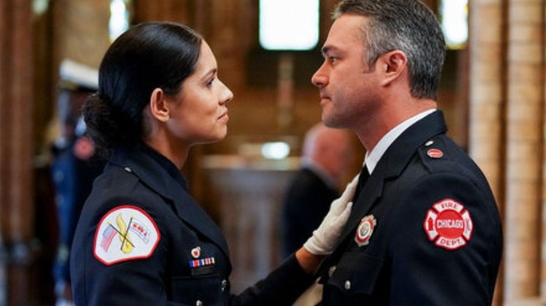 Stella Kidd and Kelly Severide smirking