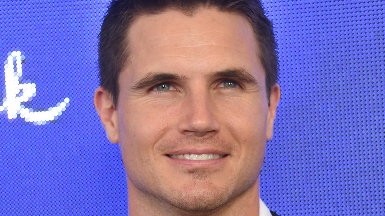 Robbie Amell posing